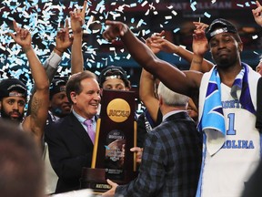 GLENDALE, AZ - APRIL 03:  Head coach Roy Williams of the North Carolina Tar Heels receives the Championship trophy after defeating the Gonzaga Bulldogs during the 2017 NCAA Men's Final Four National Championship game at University of Phoenix Stadium on April 3, 2017 in Glendale, Arizona. The Tar Heels defeated the Bulldogs 71-65.