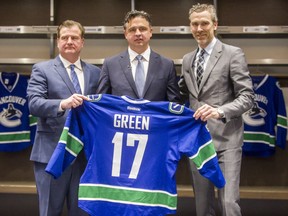 Left to right: Canucks GM Jim Benning, new head coach Travis Green and president of hockey operations, Trevor Linden at Rogers Arena in Vancouver Canucks in Vancouver, B.C., April 26, 2017.