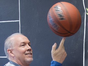 NDP Leader John Horgan is often seen with a basketball. Indeed, he credits a high school basketball coach for steering him from a troubled path.