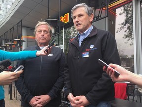 B.C. Liberal candidate Andrew Wilkinson (right) and  B.C. Restaurant and Food Services Association president Ian Tostenson speak about Vancouver's proposed natural gas restrictions Saturday, April 29, 2017.