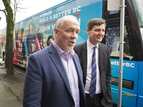 B.C. NDP leader John Horgan outside of his campaign bus in the Point Grey riding of MLA David Eby.