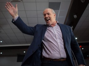 NDP Leader John Horgan waves to supporters before speaking during an election campaign kickoff rally in Surrey, B.C., on Sunday April 9, 2017. A provincial election will be held on May 9.