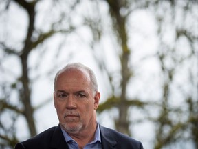 NDP Leader John Horgan listens during a health care themed campaign stop at a home in Burnaby, B.C., on Monday, April 17, 2017. A provincial election will be held on May 9.