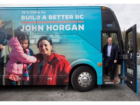 B.C. NDP Leader John Horgan steps off his campaign bus for an announcement about mental health and addiction services at the Riverview Lands, the former site of a mental health facility, in Coquitlam on Monday April 17. A provincial election will be held on May 9.