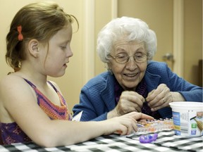 FILE PHOTO Sophia Farquhar, a six year old Big Brooks volunteer, sits with Stella Zdrill, a Brookhaven Care resident in West Kelowna on June 2, 2014.  Brookhaven Care is an Interior Health Authority long term care facility that has a program where  kids interact with the residents.