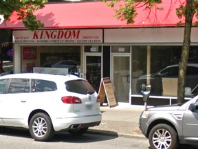 Kingdom Photo's windows were smashed by gunfire.