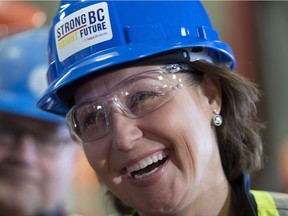 Liberal leader Christy Clark shares a laugh as she makes a campaign stop at Inland Concrete in Fort St. John, B.C., Tuesday, April 18, 2017.