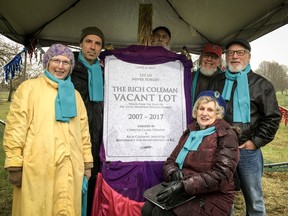 Members of Community Advocates for Little Mountain unveil a plaque honouring the "Rich Coleman Vacant Lot." Saturday marked a decade since residents of 224 social-housing units at the site were told the land was up for sale.