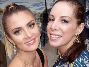 Model Natasha Mills showed Canucks Autism Network co-founder Clara Aquilini the $38,800 earrings that, with an $11,500 bracelet, will be raffled at the Reveal gala May 6.