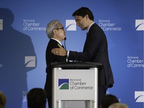 Investment consultant Paul Oei (left) introduced Justin Trudeau at a Richmond Chamber of Commerce luncheon he sponsored in July 2015.