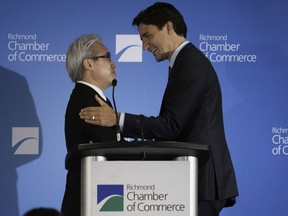 Liberal leader, now prime minister Justin Trudeau, at a 2015 Richmond Chamber of Commerce luncheon where he was greeted by Paul Oei (left).