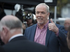 B.C. NDP party leader John Horgan on the election campaign trail outside Riverdale elementary school in Surrey, BC Wednesday, April 19, 2017.