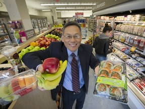 Chong Bang, Shoppers' senior vice-president of merchandising, shows off some of the fresh food items now available at the drugstore's East Hastings location.