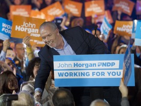 NDP Leader John Horgan speaks to a large rally at the Commodore Ballroom in Vancouver on Sunday.