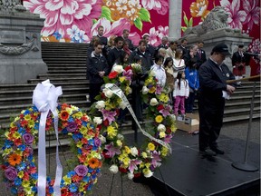 A moment of silence is observed on April 28, 2010, at the Day of Mourning rally at the Vancouver Art Gallery.