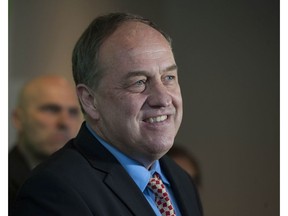 B.C. Green Party leader Andrew Weaver, surrounded by local candidates, speaks to the media in Vancouver, BC Wednesday, April 12, 2017.