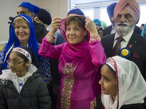 B.C. Liberal Leader Christy Clark joins in the Vaisakhi celebrations in Vancouver with Suzanne Anton, left, the Liberals' incumbent in Vancouver-Fraserview.