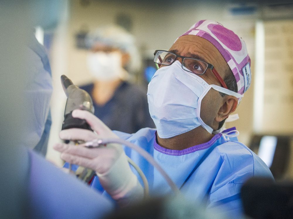 Dr. Amin Javer performs sinus surgery on a patient at False Creek Surgery Centre in Vancouver. 