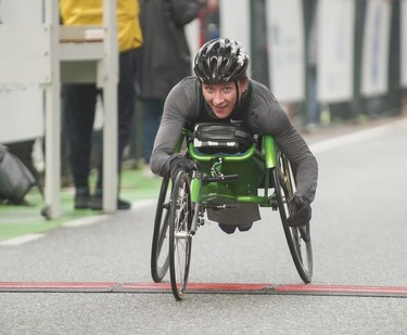 Jessica Frotten is first woman wheelchair athlete to cross finish line as about 40,000 runners competed in 2017 Vancouver Sun Run in Vancouver, B.C., April 23, 2017.