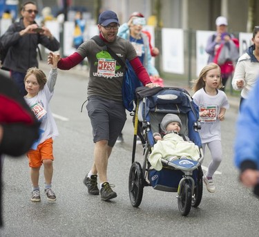 Parents and kids compete in the Shaw Mini Sun Run before 40,000 competitors competed in 2017 Vancouver Sun Run in Vancouver, B.C., April 23, 2017.