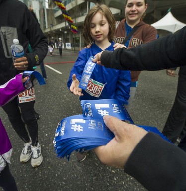 Parents and kids compete in the Shaw Mini Sun Run before 40,000 competitors competed in 2017 Vancouver Sun Run in Vancouver, B.C., April 23, 2017.