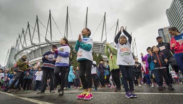 Parents and kids prepare to compete in the Shaw Mini Sun Run before 40,000 competitors competed in 2017 Vancouver Sun Run in Vancouver, B.C., April 23, 2017.