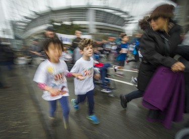 Parents and kids prepare to compete in the Shaw Mini Sun Run before 40,000 competitors competed in 2017 Vancouver Sun Run in Vancouver, B.C., April 23, 2017.