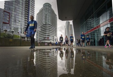 People make their way from the Sun Run as about 40,000 runners competed in 2017 Vancouver Sun Run in Vancouver, B.C., April 23, 2017.