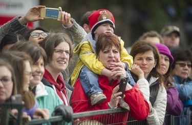 People watch for friends and family to cross the finish line as about 40,000 runners competed in 2017 Vancouver Sun Run in Vancouver, B.C., April 23, 2017.