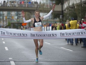 Vancouver’s Rachel Cliff crosses the finish line to win the women’s race in the 2014 Vancouver Sun Run — the only other time she has competed in the annual event.
