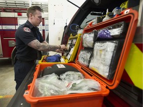 The number of overdose calls Vancouver firefighters deal with on a daily basis can be overwhelming, but are becoming routine. More so at Firehall #2 in the Downtown Eastside. Pictured is firefighter Chris Burshtynski restocking an overdose kit.