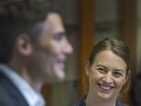 Newly appointed chief resilience officer Katie McPherson smiles as Mayor Gregor Robertson speaks during a news conference announcing her appointment in Vancouver on Tuesday.