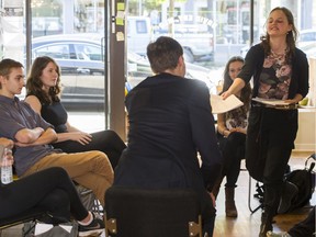 MLA David Eby takes delivery of a 200-name petition from Abbey Clancy, right, and other students at his office ain Vancouver in April 2015, opposing a proposed thermal-coal export facility in B.C.