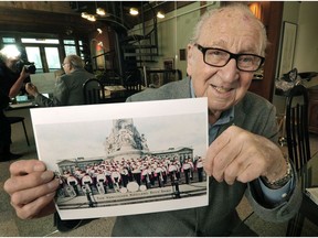 Dal Richards holds a photo of the Kitsilano Boys Band taken in 1933. He was a member of the band.