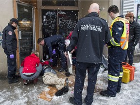 A Vancouver Fire Department Medical Unit responds to an unresponsive man after the male injected a drug, in the Downtown Eastside at Vancouver in December 2016.