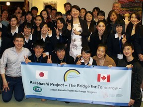 Visiting students from Japan surround Japan's Vancouver consul general Asako Okai (standing) at an event at a Kakehashi Project event in Metro Vancouver.