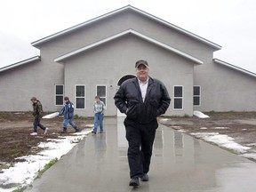 Winston Blackmore is seen outside his community hall in the isolated religious commune of Bountiful, B.C., on Nov. 23, 2011. Winston Blackmore filed a petition in late February asking the B.C. Supreme Court to quash the criminal charge, arguing that B.C.'s attorney general improperly appointed Peter Wilson, the special prosecutor who recommended the charge.