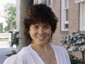 FILE - This Feb. 19, 1982 file photo shows actress Erin Moran of the television show, &ampquot;Happy Days&ampquot; in Los Angeles. A photo shared online on May 3, 2017, shows the cast of ‚ÄúHappy Days‚Äù briefly reunited at a memorial service for Moran, who died at her Indiana home last month. (AP Photo/Wally Fong, File)