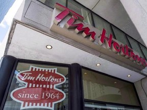 A Tim Hortons coffee shop in downtown Toronto is pictured on June 29, 2016. The CEO of the parent company of Tim Hortons is brushing off skepticism that the British will embrace its double-doubles and Timbits as it readies to open its first location in the United Kingdom next month. THE CANADIAN PRESS/Eduardo Lima