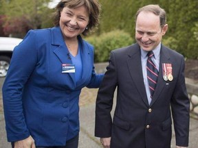B.C. Liberal leader Christy Clark shares a laugh with local candidate Jim Benninger during a campaign stop in Courtney, B.C., Monday, May 8, 2017. Jim Benninger knows that a lot of people think the difference between a Liberal majority or minority government in British Columbia is resting on his shoulders. The Liberal candidate in Courtenay-Comox lost by nine votes after advance and general ballots were counted on Tuesday, leaving the party with one seat short of the 44 needed to mount their fif