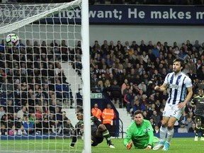Chelsea&#039;s Michy Batshuayi, centre, scores a goal during the English Premier League soccer match between West Bromwich Albion and Chelsea, at the Hawthorns in West Bromwich, England, Friday, May 12, 2017. (AP Photo/Rui Vieira)