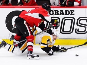 Ottawa Senators defenceman Marc Methot (3) takes down Pittsburgh Penguins centre Sidney Crosby (87) during the third period of game six of the Eastern Conference final in the NHL Stanley Cup hockey playoffs in Ottawa on Tuesday, May 23, 2017. THE CANADIAN PRESS/Sean Kilpatrick