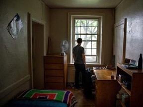 In this Tuesday, May 23, 2017, photo, provided by Facebook, CEO Mark Zuckerberg looks out the window in his old dorm room at Harvard University, in Cambridge, Mass. Zuckerberg started Facebook in his dorm room in 2004, and also met his wife, Priscilla Chan, at Harvard. On Thursday, May 25, Zuckerberg will give the commencement address at the university, where he dropped out 12 years earlier to focus on Facebook. (Courtesy of Facebook via AP)