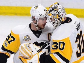 Pittsburgh Penguins centre Sidney Crosby (87) celebrates with Penguins goalie Matt Murray (30) after defeating the Ottawa Senators in game four of the Eastern Conference final in the NHL Stanley Cup hockey playoffs in Ottawa on Friday, May 19, 2017. Sidney Crosby was his usual cool self as he prepared for another monumental game in his already storied career. Getting to the final for the fourth time in less than 10 years would be a remarkable feat on its own for the Cole Harbour, N.S., native an