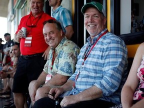 B.C. Green party leader Andrew Weaver and B.C. NDP leader John Horgan take in the final match between Team Canada and New Zealand during cup final action at the HSBC Canada Women&#039;s Sevens at Westhills Stadium in Langford, B.C., on Sunday, May 28, 2017. THE CANADIAN PRESS/Chad Hipolito