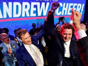 Andrew Scheer, right, is congratulated by Maxime Bernier after being elected the new leader of the federal Conservative party at the federal Conservative leadership convention in Toronto on Saturday, May 27, 2017. THE CANADIAN PRESS/Frank Gunn