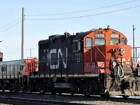 A CN locomotive goes through the CN Taschereau yard in Montreal, Saturday, Nov., 28, 2009. The union representing approximately 3,000 employees at Canadian National Railway says it has reached a verbal agreement with the company, hours before the workers were in a legal strike position. THE CANADIAN PRESS/Graham Hughes