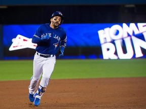 Toronto Blue Jays second baseman Devon Travis (29) rounds the bases after hitting a two-run homer during seventh inning interleague baseball action in Toronto on Wednesday, May 31, 2017. THE CANADIAN PRESS/Nathan Denette