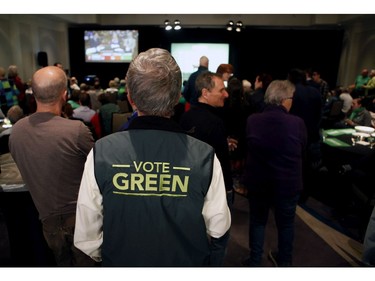 Green party supporters watch as results come in from election night at the Delta Ocean Pointe in Victoria.