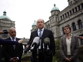 Green party leader Andrew Weaver is joined by newly elected party members Adam Olsen and Sonia Furstenau in Victoria on Wednesday.